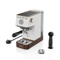 An All-in-one barista coffee machine with built-in grinder, milk frothing steam wand, and detachable water tank, perfect for making espresso, cappuccino, latte, and macchiato at home.